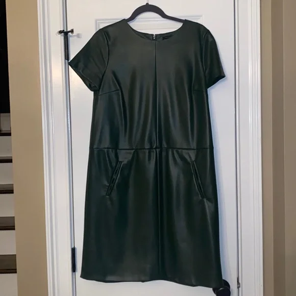 Ann Taylor size 6 faux leather dress with pockets. A line, falls at knee. Ann Taylor size 6 faux leather dress with pockets. A line, falls at knee.